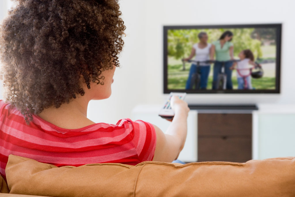 Young woman Watch Streaming TV with fast internet connection