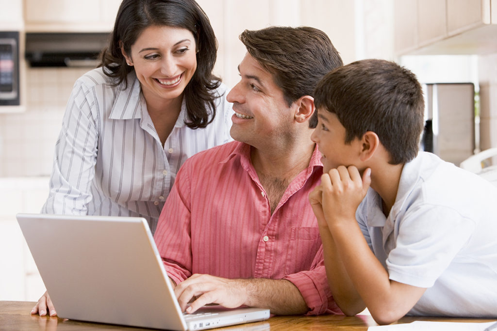 Family using wifi internet on laptop